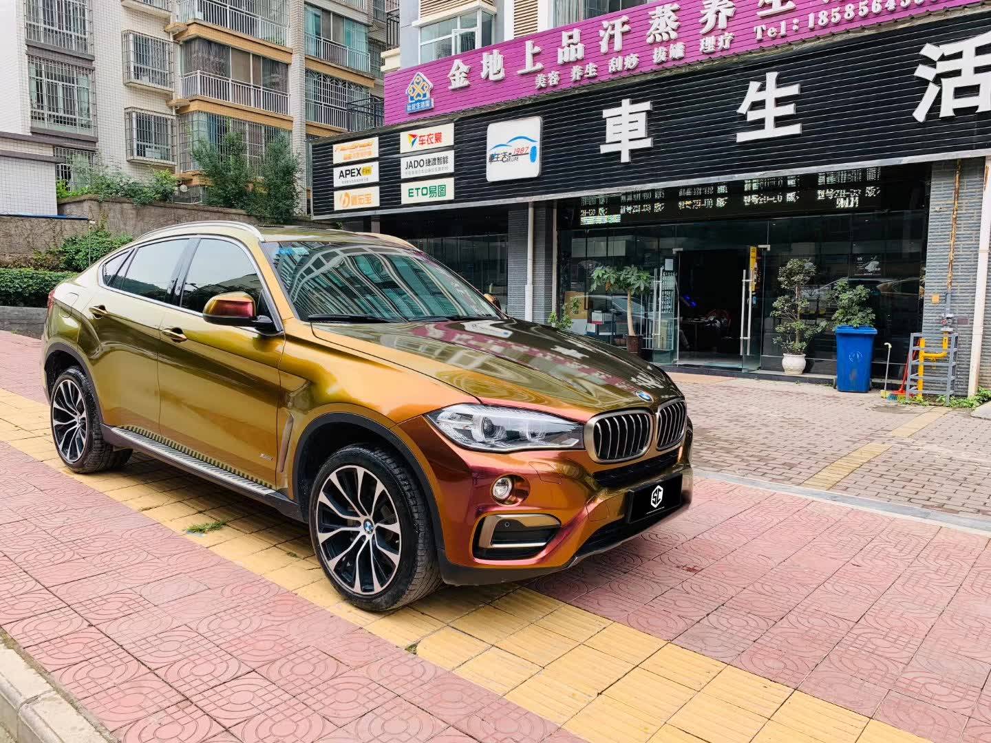 sc改色膜—宝马x6贴膜流光溢彩旭日红_贴膜