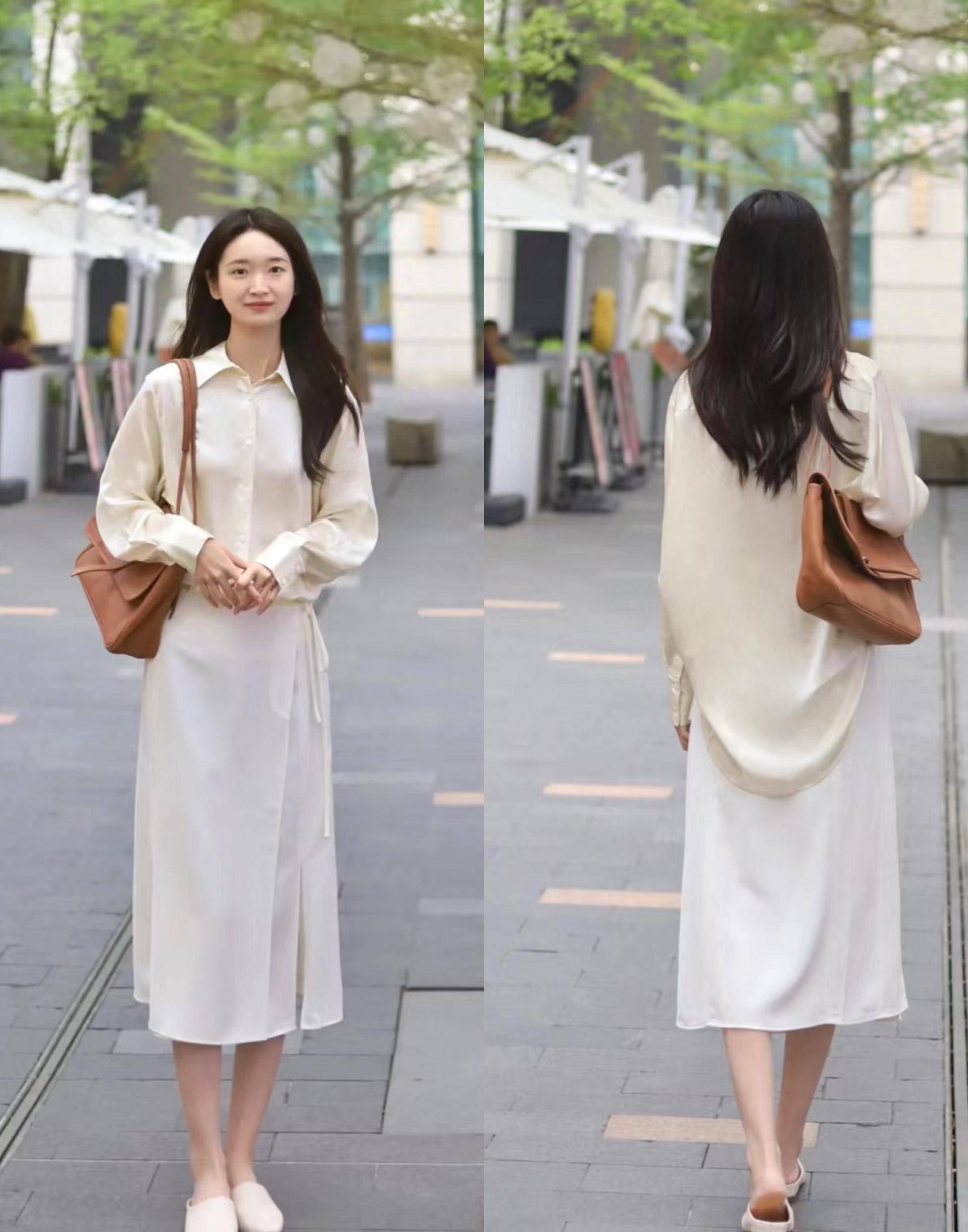 可以穿天蓝色衬衫搭配黑白条纹针织背心,下搭修身a字裙,增添好女孩