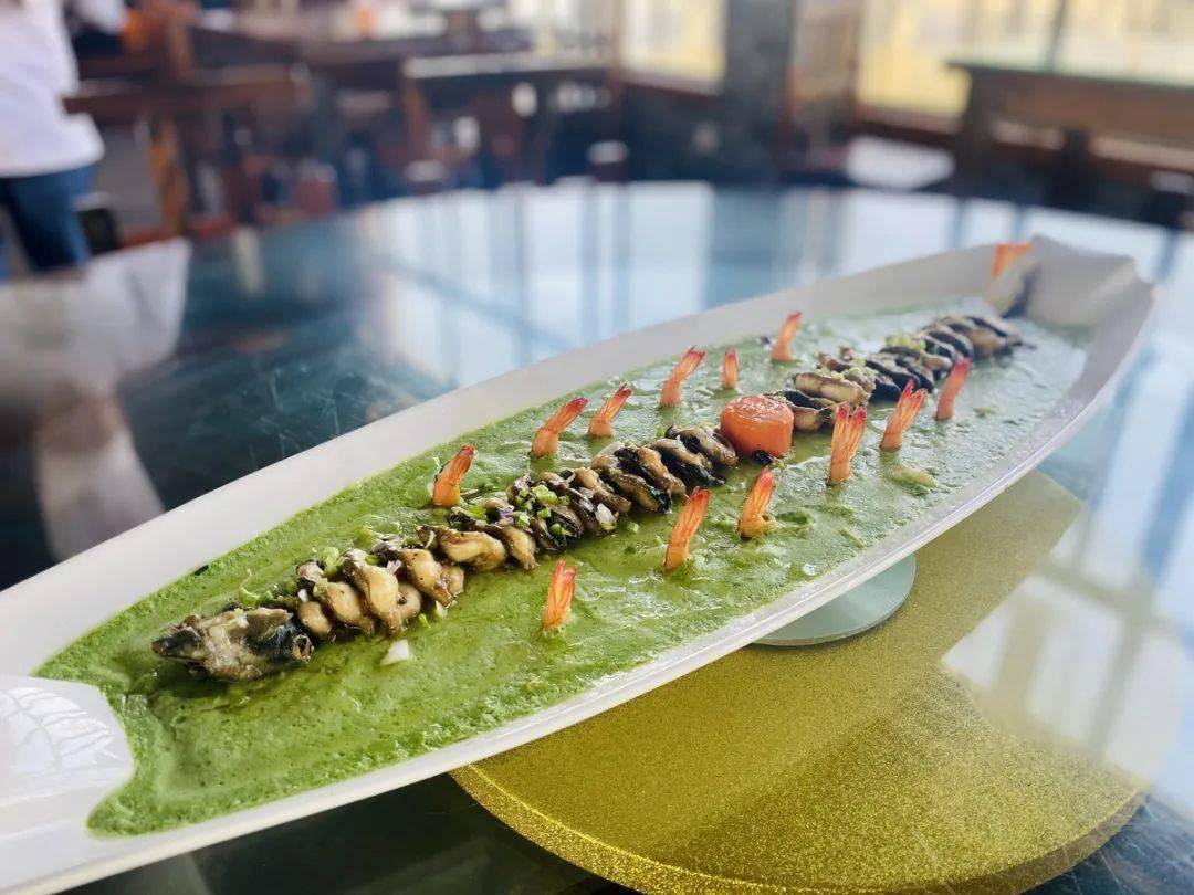 第二届百村名菜争霸赛金牌菜之一"龙耀沧江".